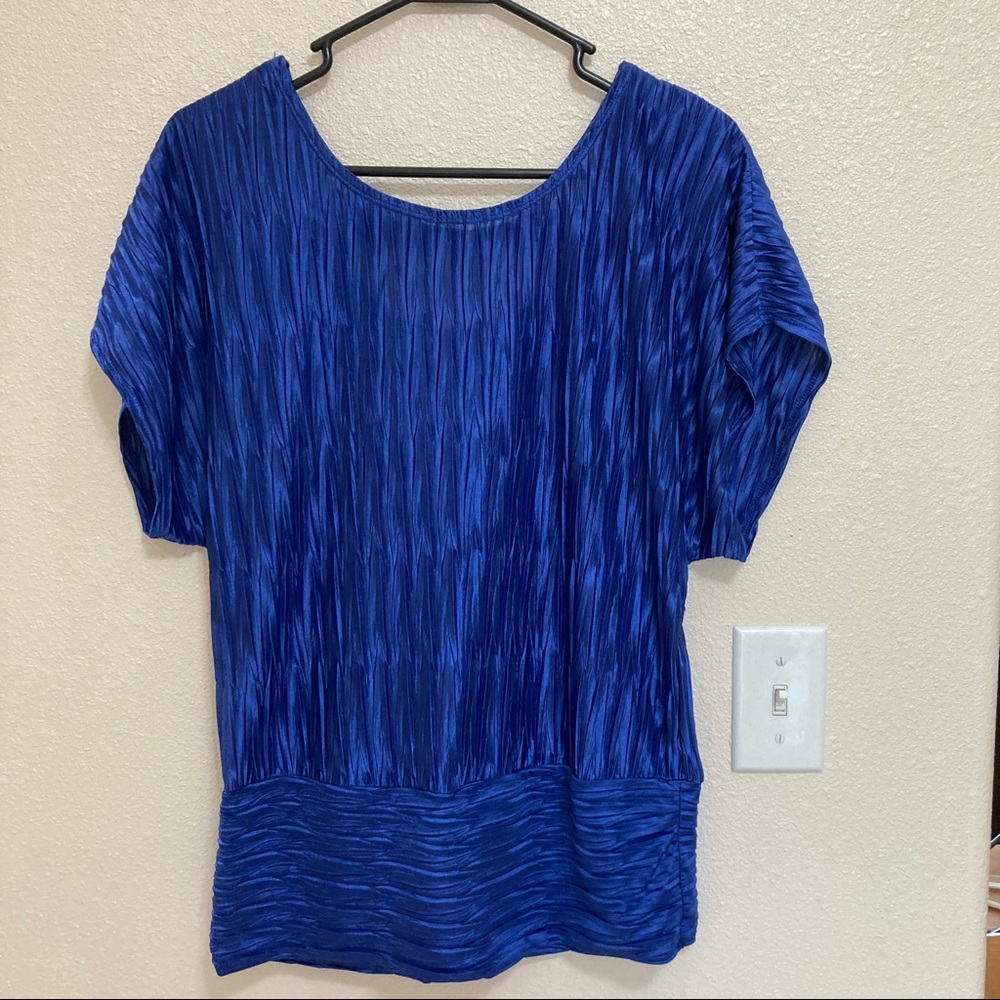Blue dolman style stop with cut out back